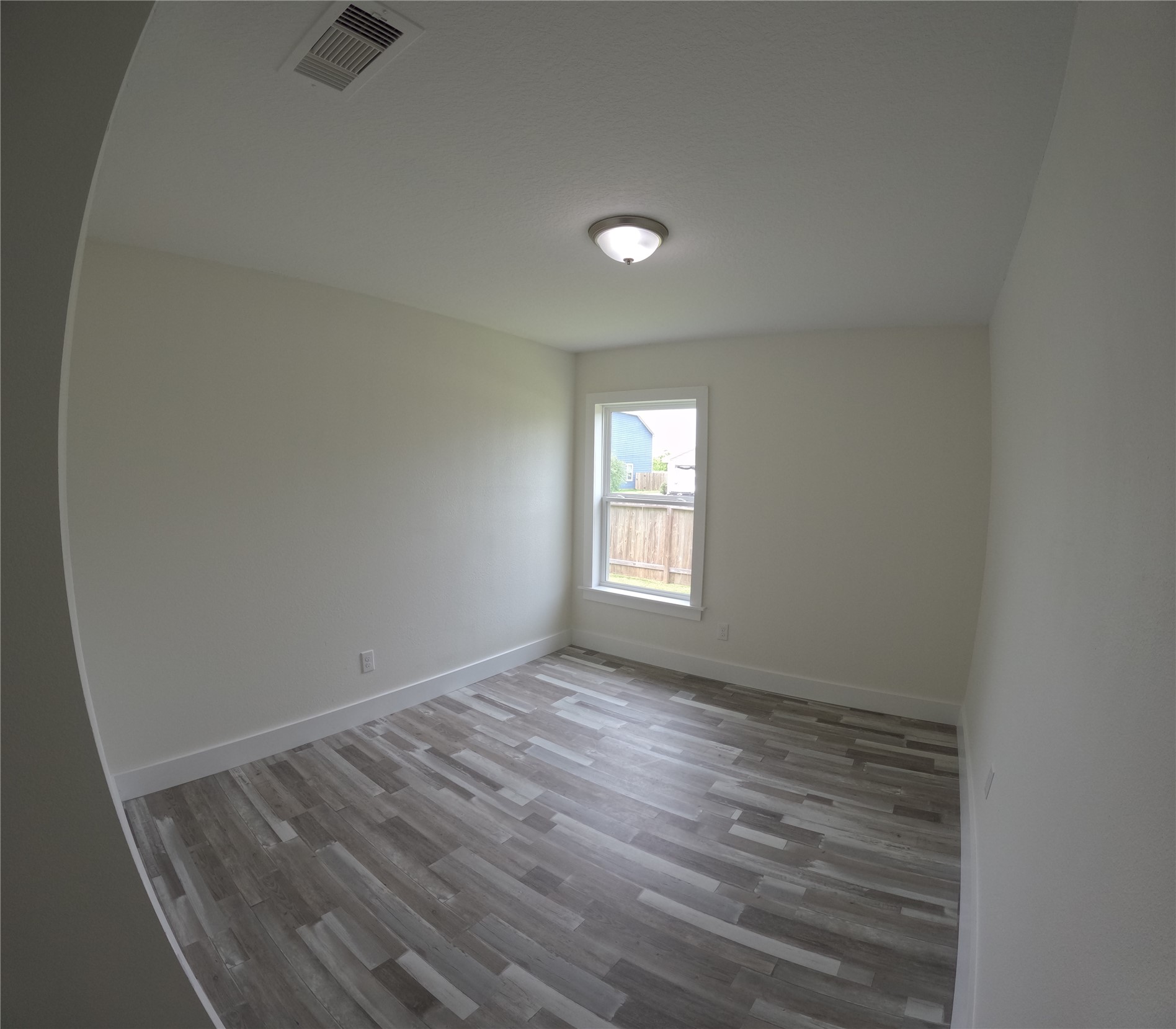 8419 Hannah Rd Cove Cove, TX 77523 - Photo 18 of 28 wooden floor in an empty room with a window