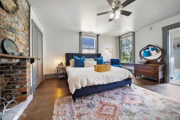 a bedroom with bed and window