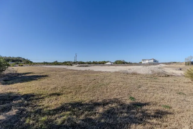 an aerial view of a residential houses with outdoor space