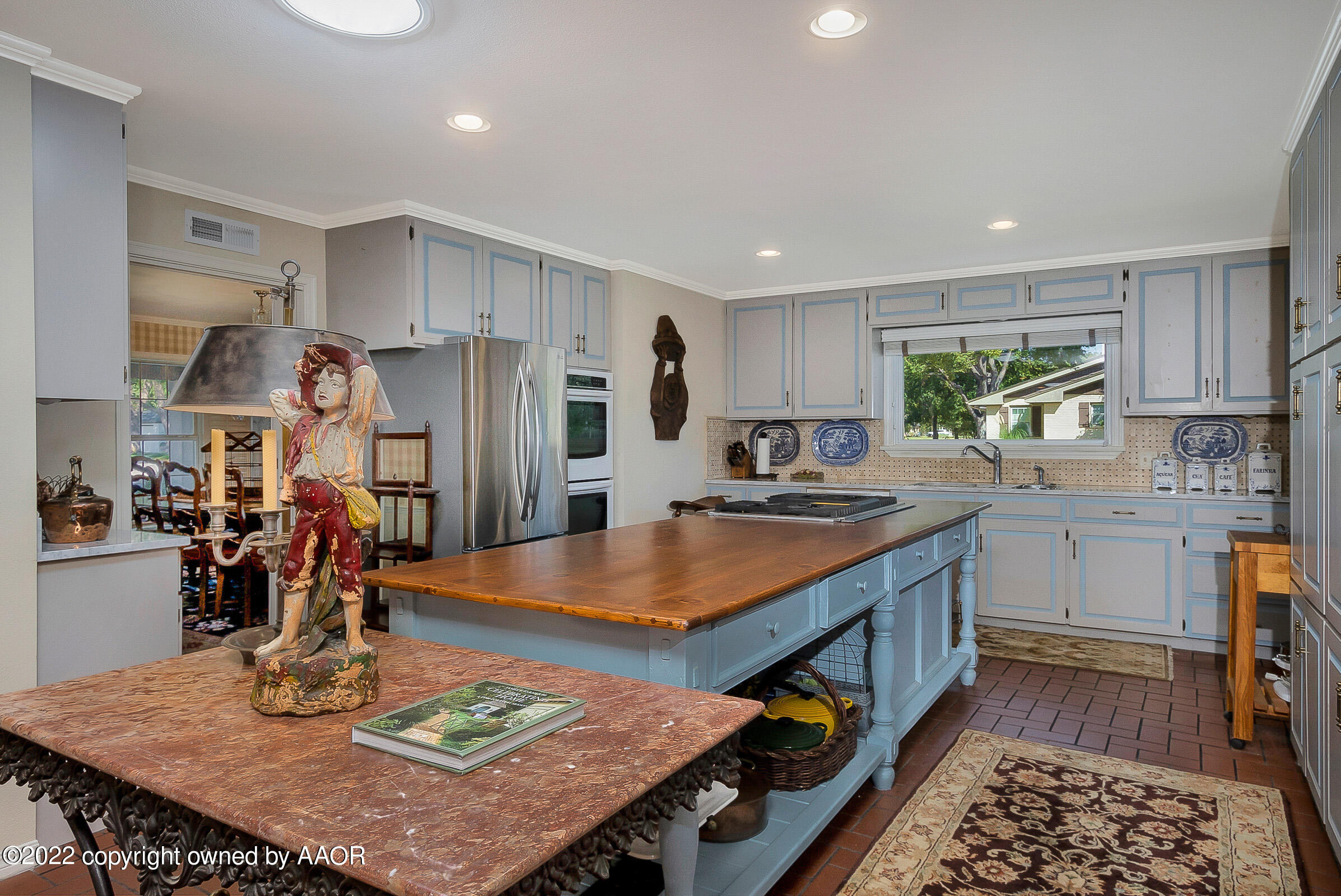 1601 South Austin Street Amarillo, TX 79102 - Photo 13 of 46 a kitchen with stainless steel appliances granite countertop a stove refrigerator sink and microwave