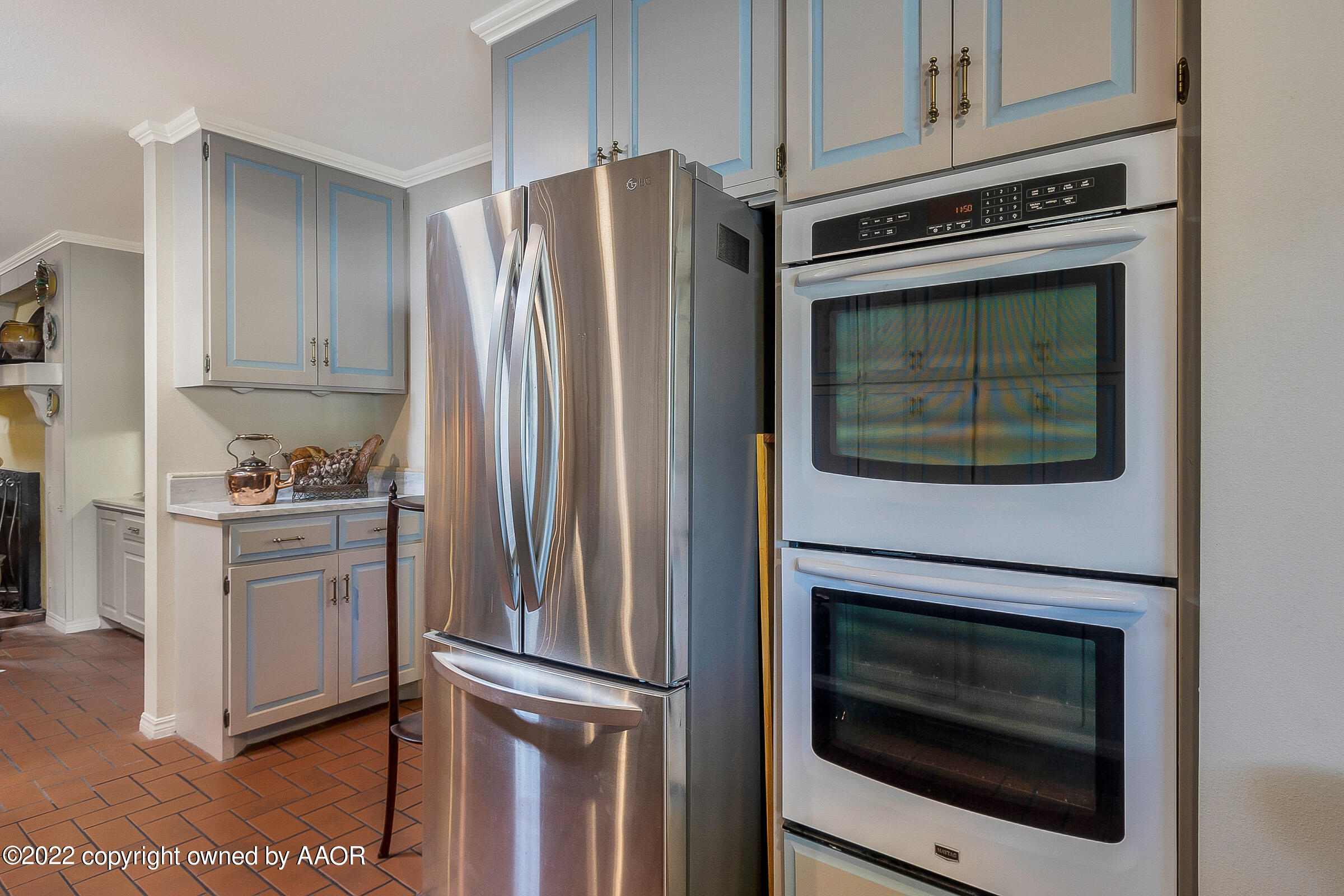 1601 South Austin Street Amarillo, TX 79102 - Photo 16 of 46 a kitchen with cabinets and stainless steel appliances