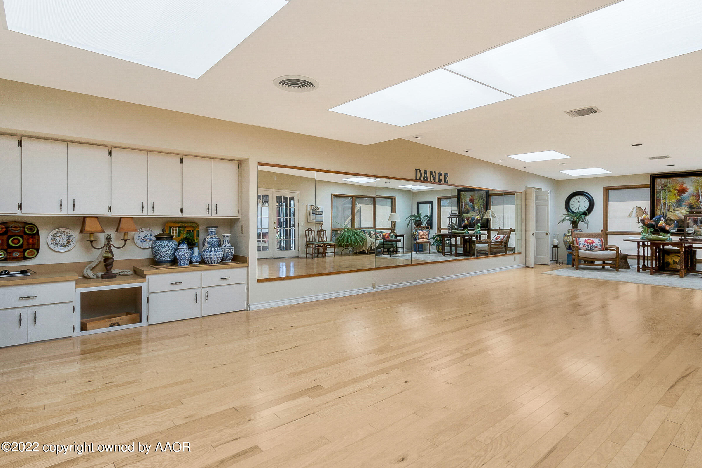 1601 South Austin Street Amarillo, TX 79102 - Photo 20 of 46 a large white kitchen with lots of counter top space a sink and cabinets