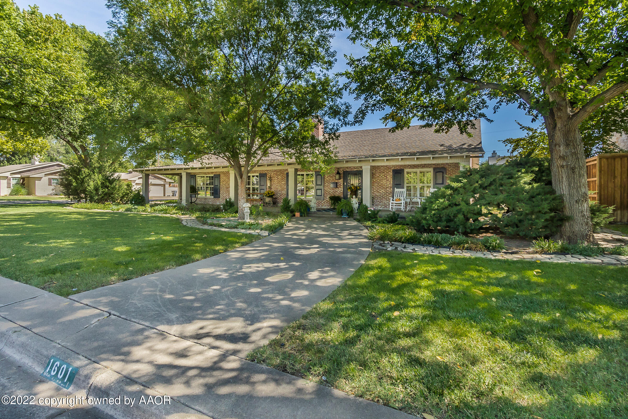 1601 South Austin Street Amarillo, TX 79102 - Photo 2 of 46 a front view of a house with a garden