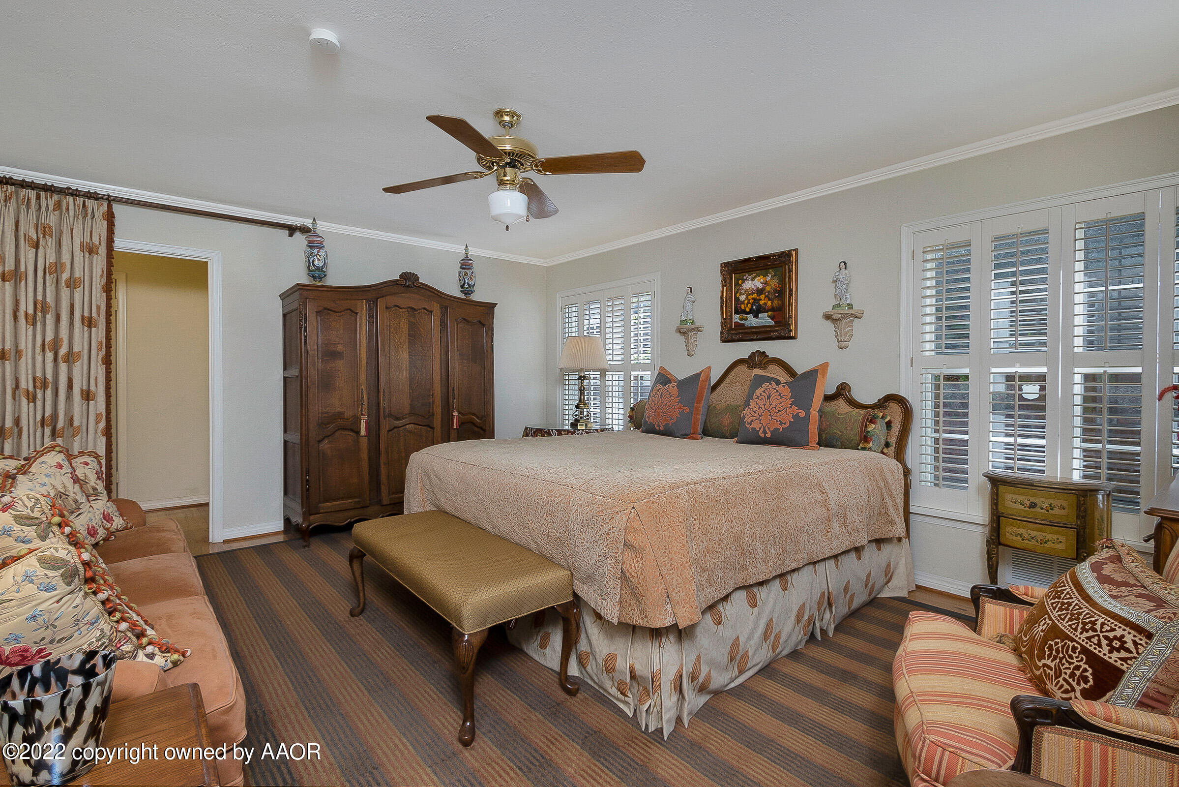 1601 South Austin Street Amarillo, TX 79102 - Photo 23 of 46 a bedroom with a large bed and a chandelier