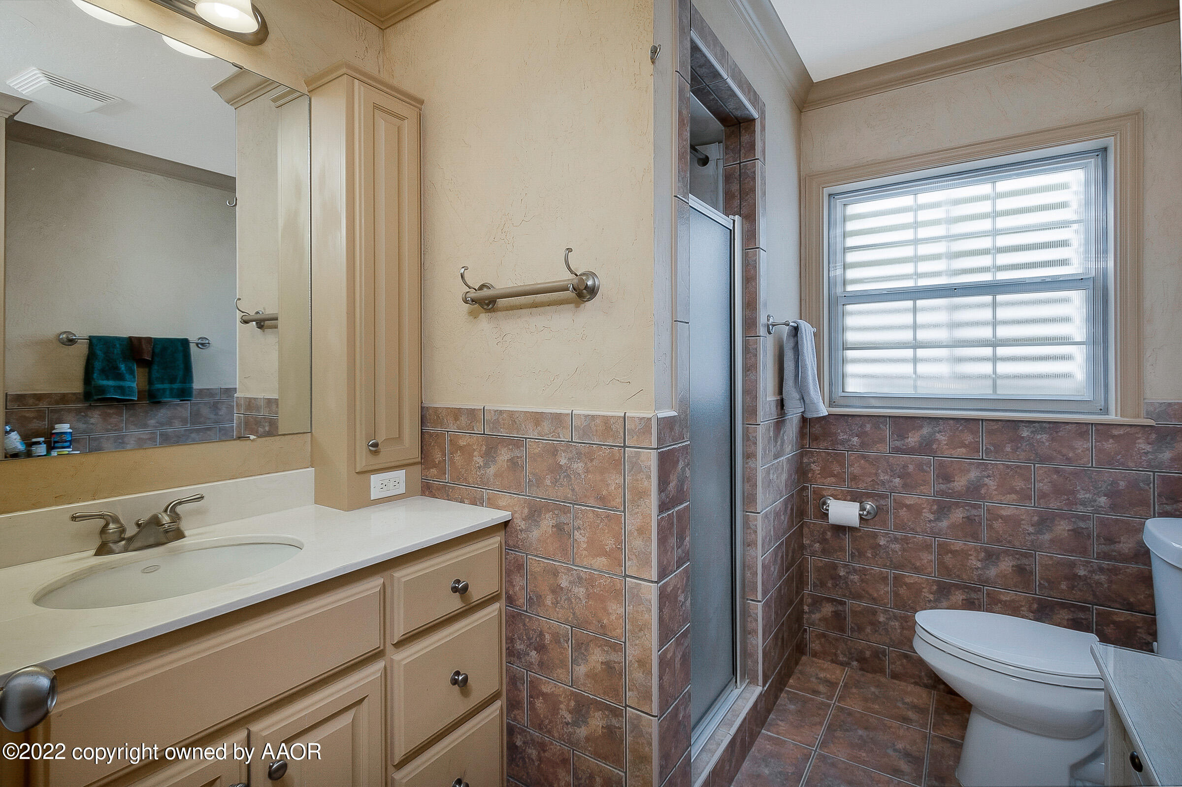 1601 South Austin Street Amarillo, TX 79102 - Photo 25 of 46 a bathroom with a granite countertop sink toilet and shower
