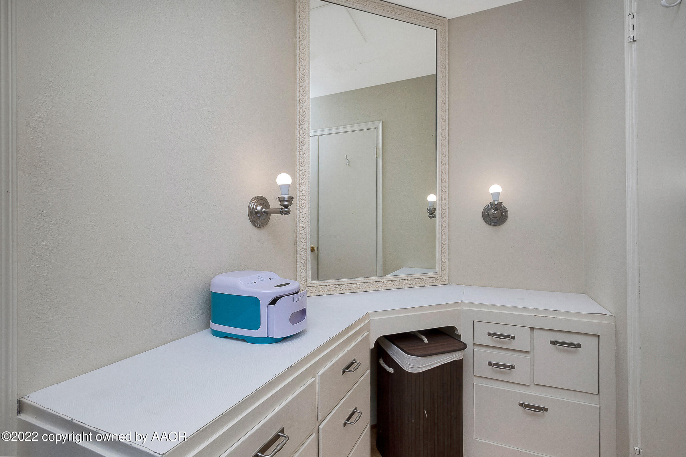 1601 South Austin Street Amarillo, TX 79102 - Photo 27 of 46 a bathroom with a sink and a mirror