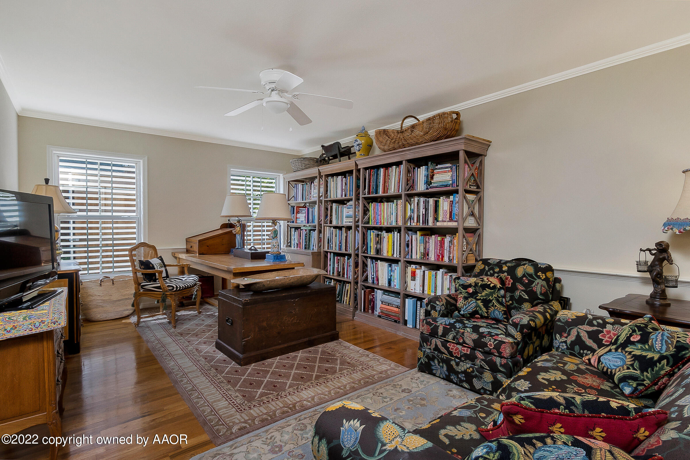 1601 South Austin Street Amarillo, TX 79102 - Photo 28 of 46 a living room with furniture a rug and a book shelf