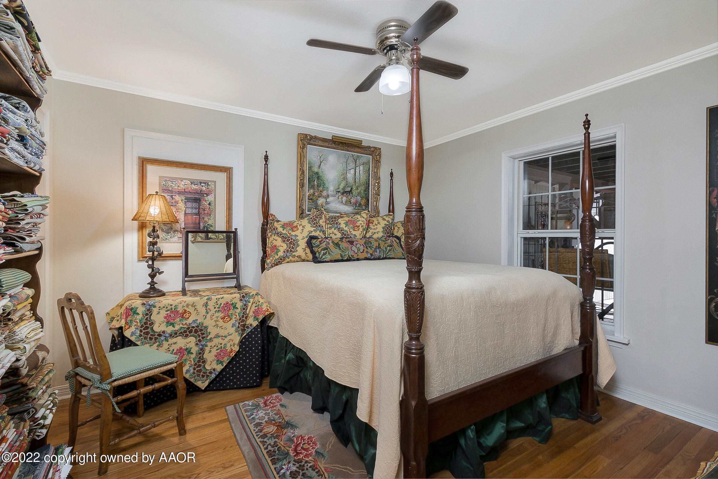 1601 South Austin Street Amarillo, TX 79102 - Photo 32 of 46 a bedroom with a bed and a chandelier