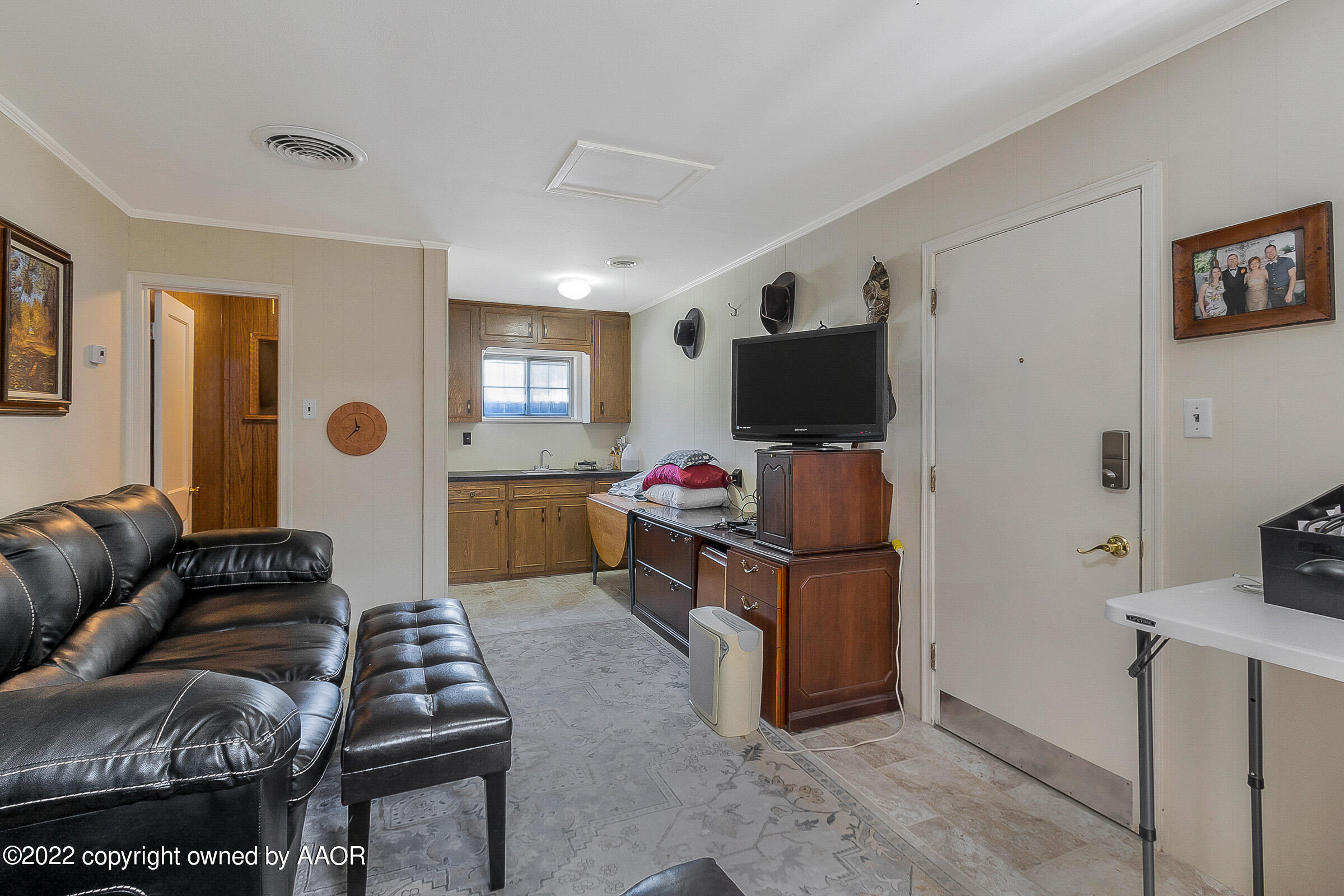 1601 South Austin Street Amarillo, TX 79102 - Photo 35 of 46 a living room with furniture and a flat screen tv