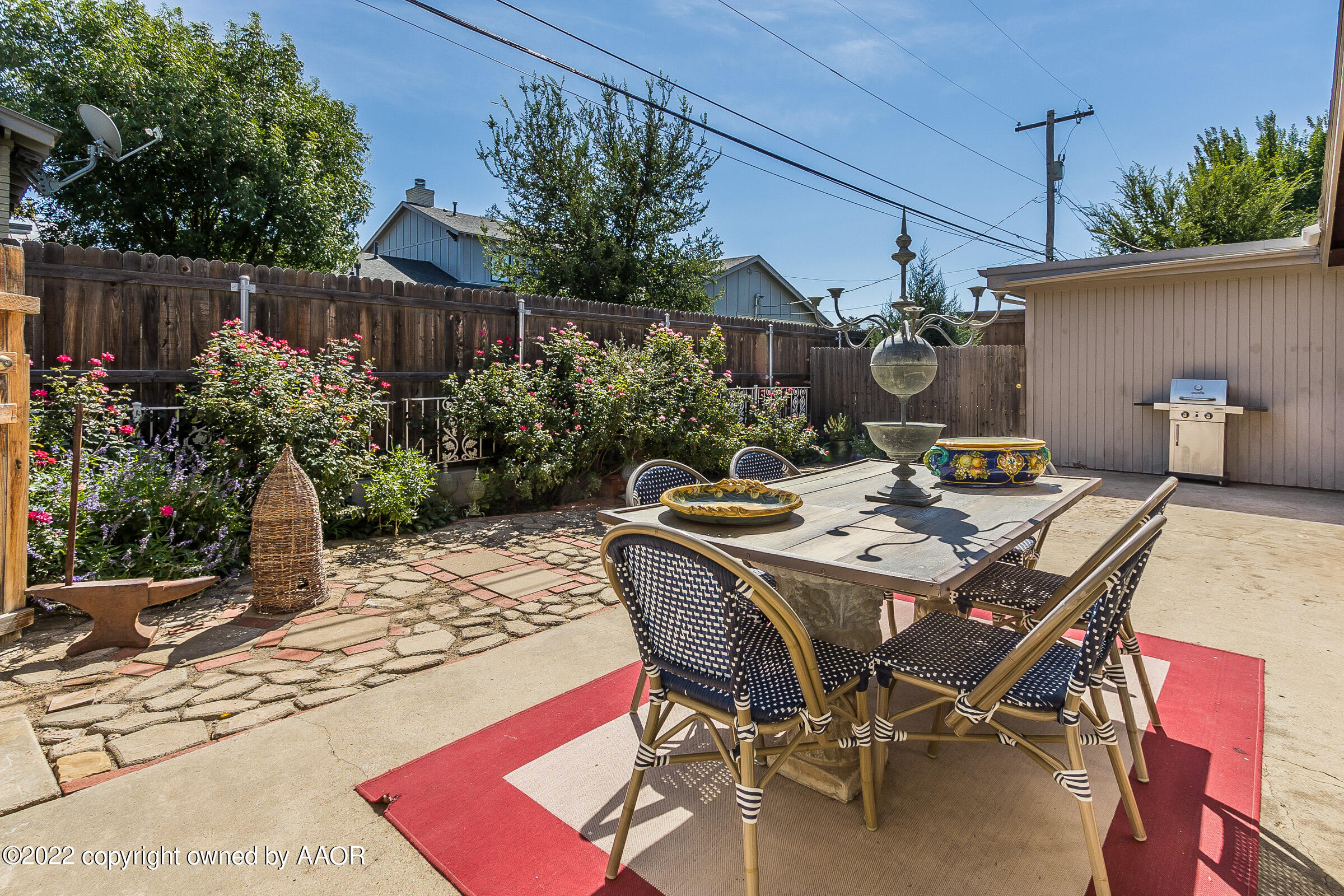 1601 South Austin Street Amarillo, TX 79102 - Photo 42 of 46 a view of a backyard with table and chairs potted plants and tree