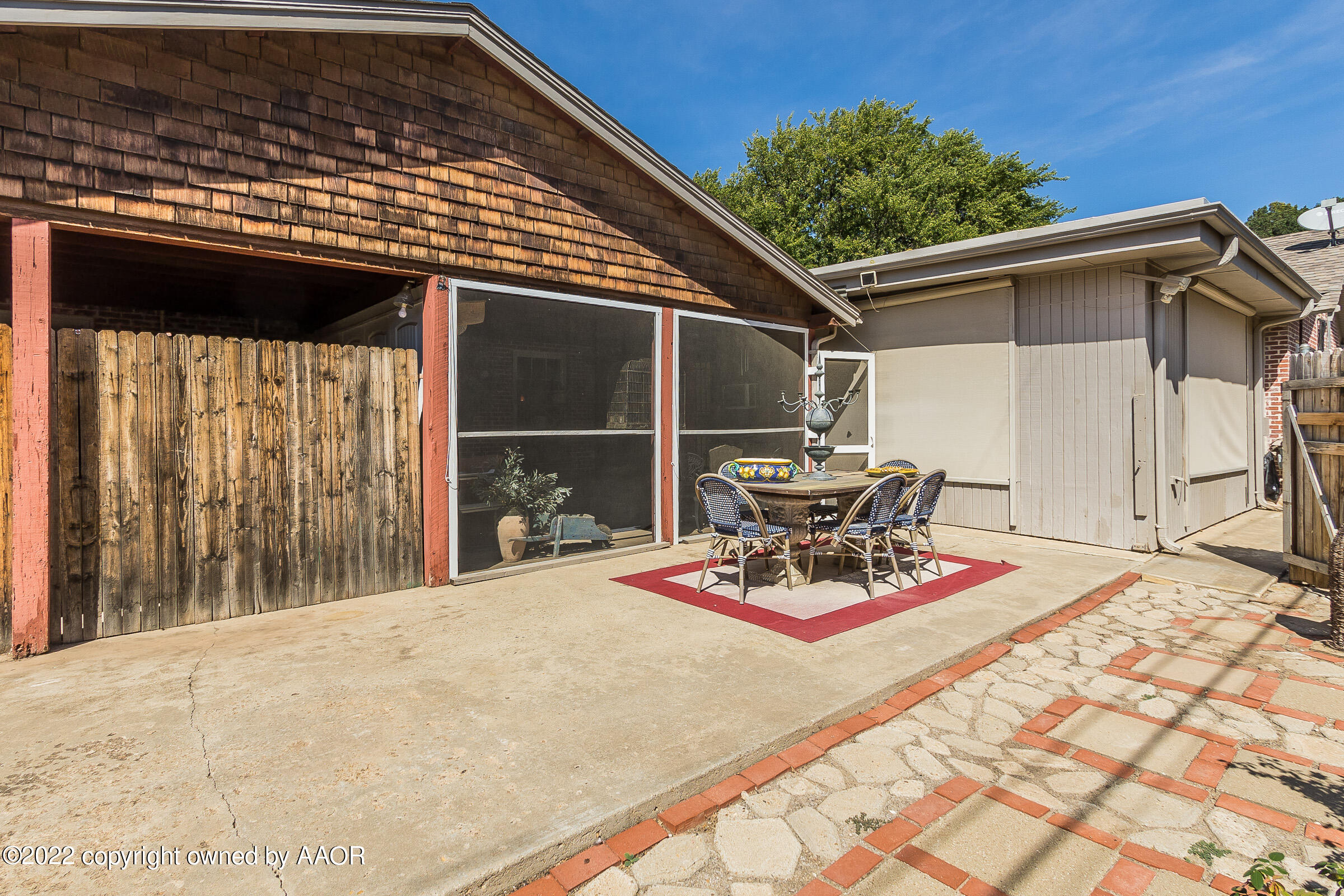 1601 South Austin Street Amarillo, TX 79102 - Photo 43 of 46 a view of a patio with table and chairs and wooden floor