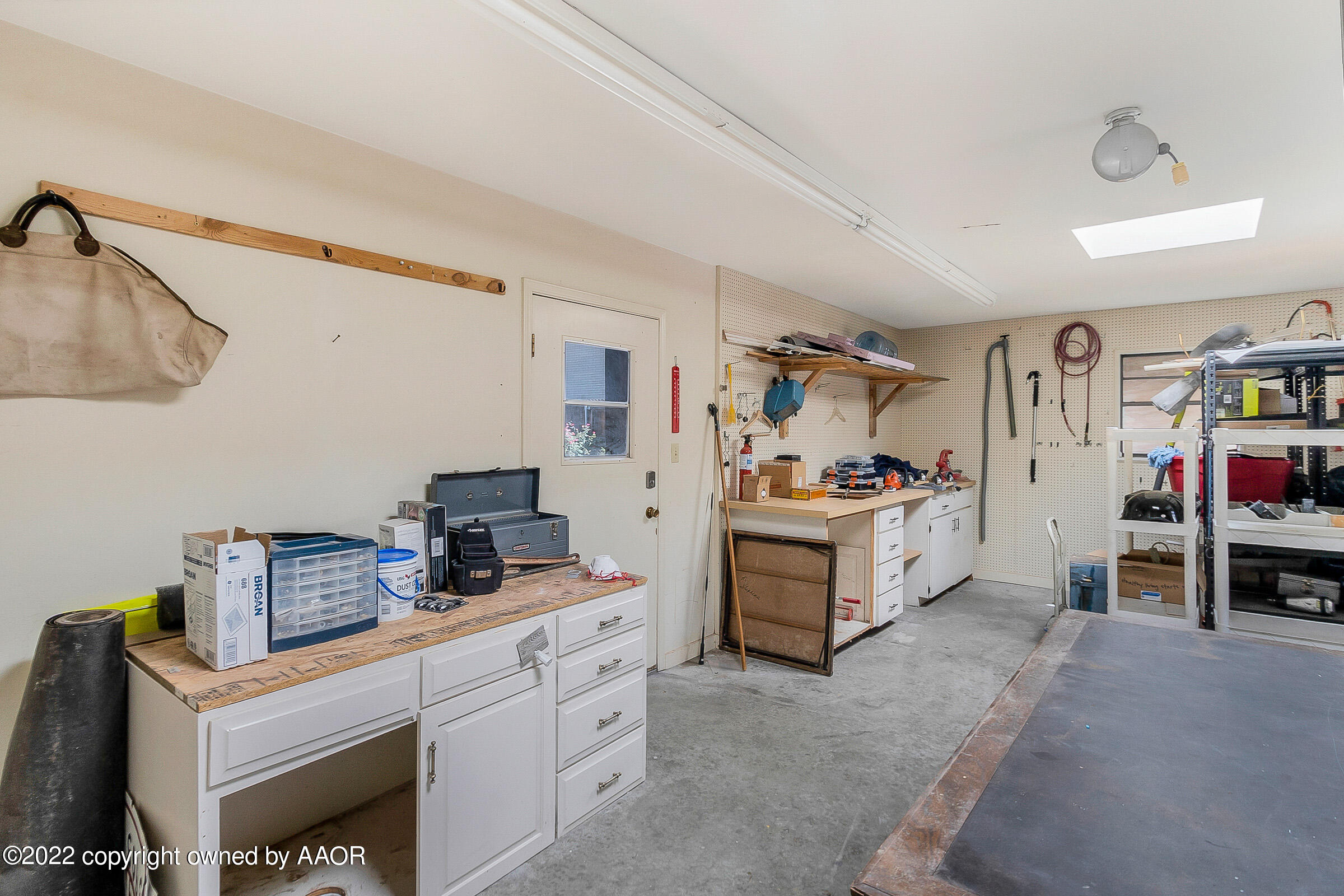 1601 South Austin Street Amarillo, TX 79102 - Photo 45 of 46 a kitchen with stainless steel appliances kitchen island granite countertop a stove and a sink