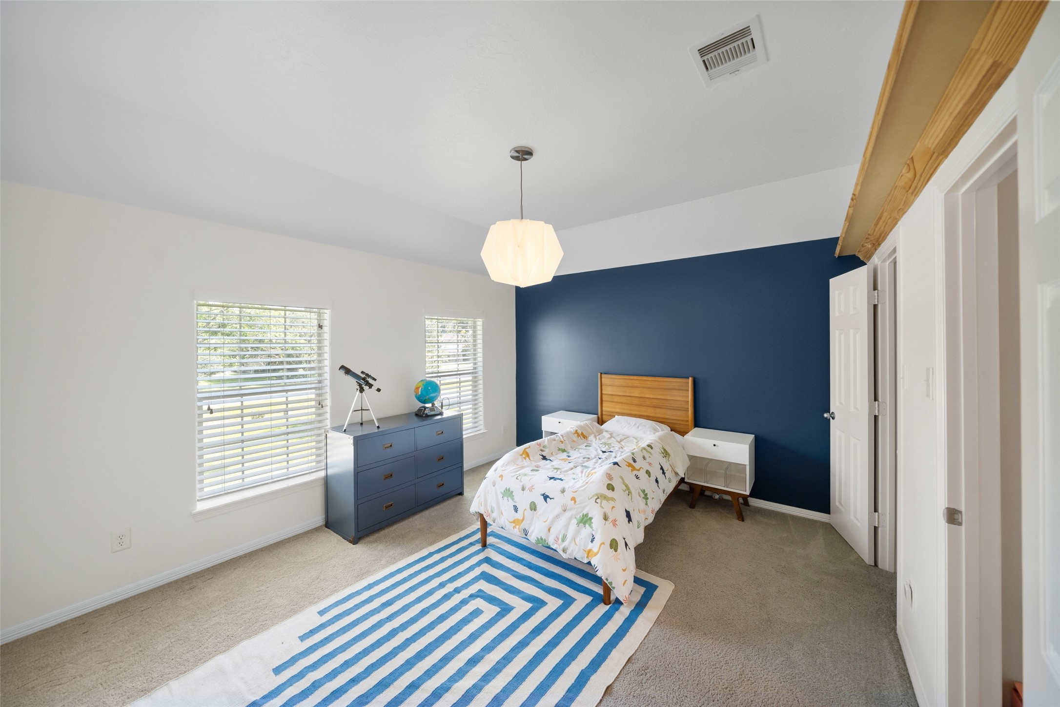 2302 Legends Shore Drive Spring, TX 77386 - Photo 43 of 48 Bright and cheerful bedroom filled with natural light and a fresh, inviting feel.