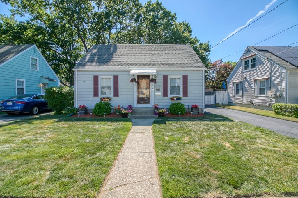 a front view of house with yard and green space