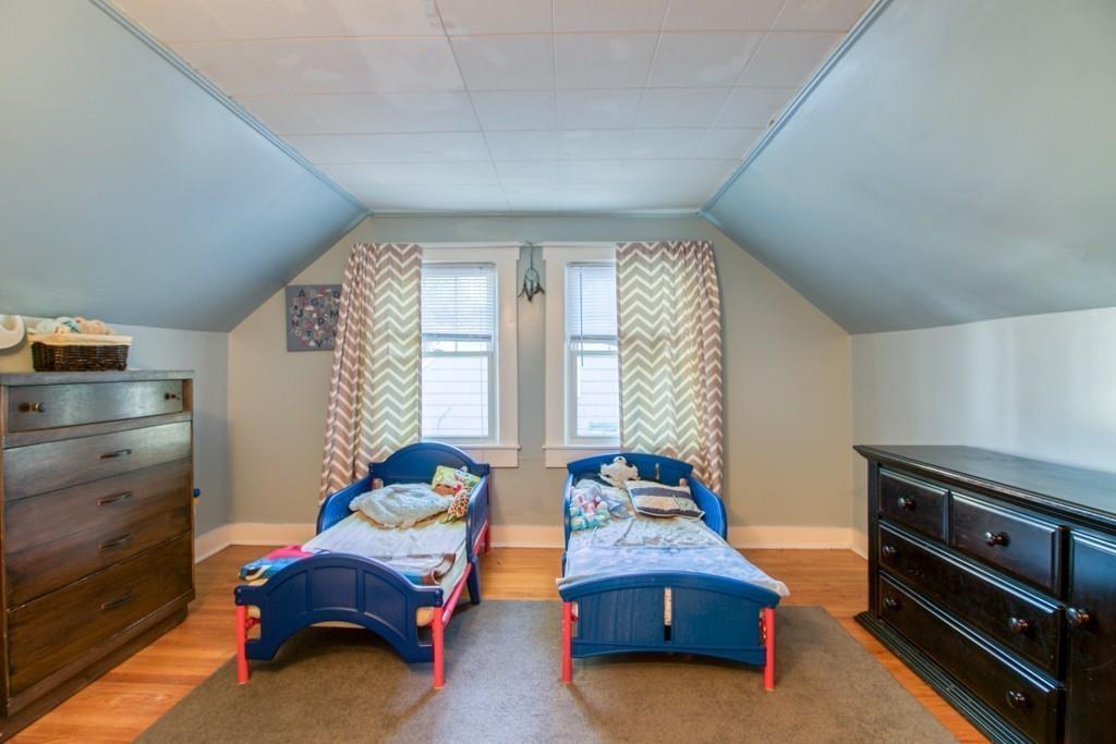 146 Powell Avenue Springfield, MA 01118 - Photo 20 of 22 a bedroom with furniture and a window