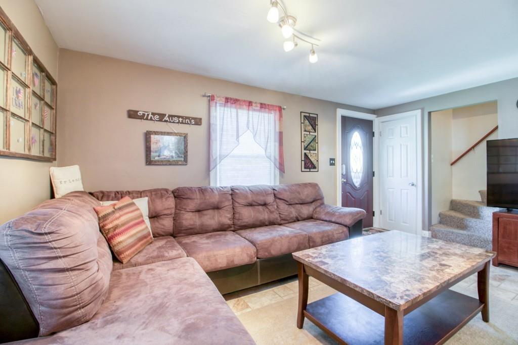 146 Powell Avenue Springfield, MA 01118 - Photo 7 of 22 a living room with furniture and a flat screen tv