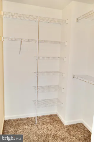 a view of a room with racks on the wall