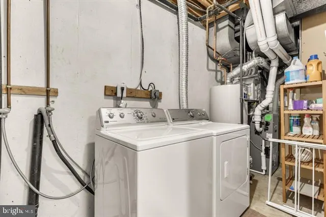 a view of empty room with a refrigerator