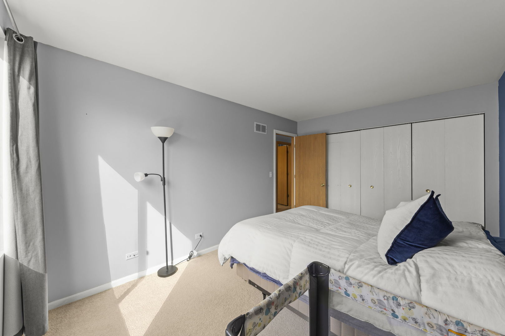 1719 Ravine Park Lane Aurora, IL 60504 - Photo 11 of 23 a view of a bedroom with a bed and wooden floor