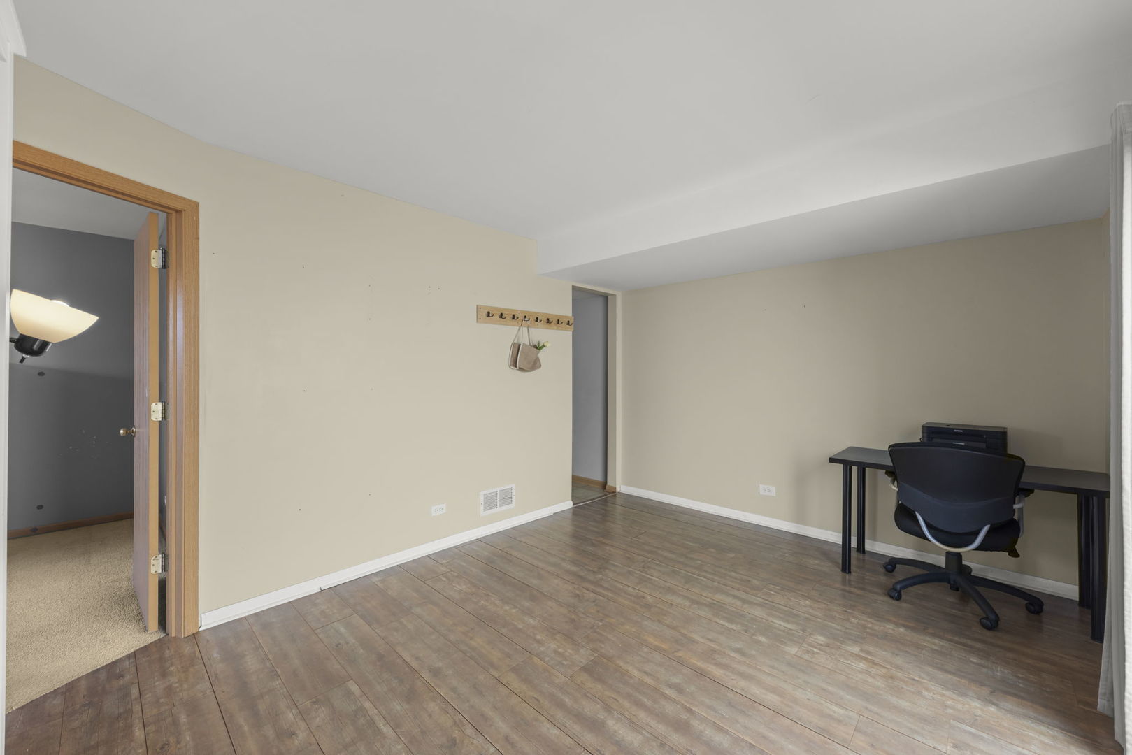 1719 Ravine Park Lane Aurora, IL 60504 - Photo 14 of 23 a view of workspace with wooden floor and lounge chair