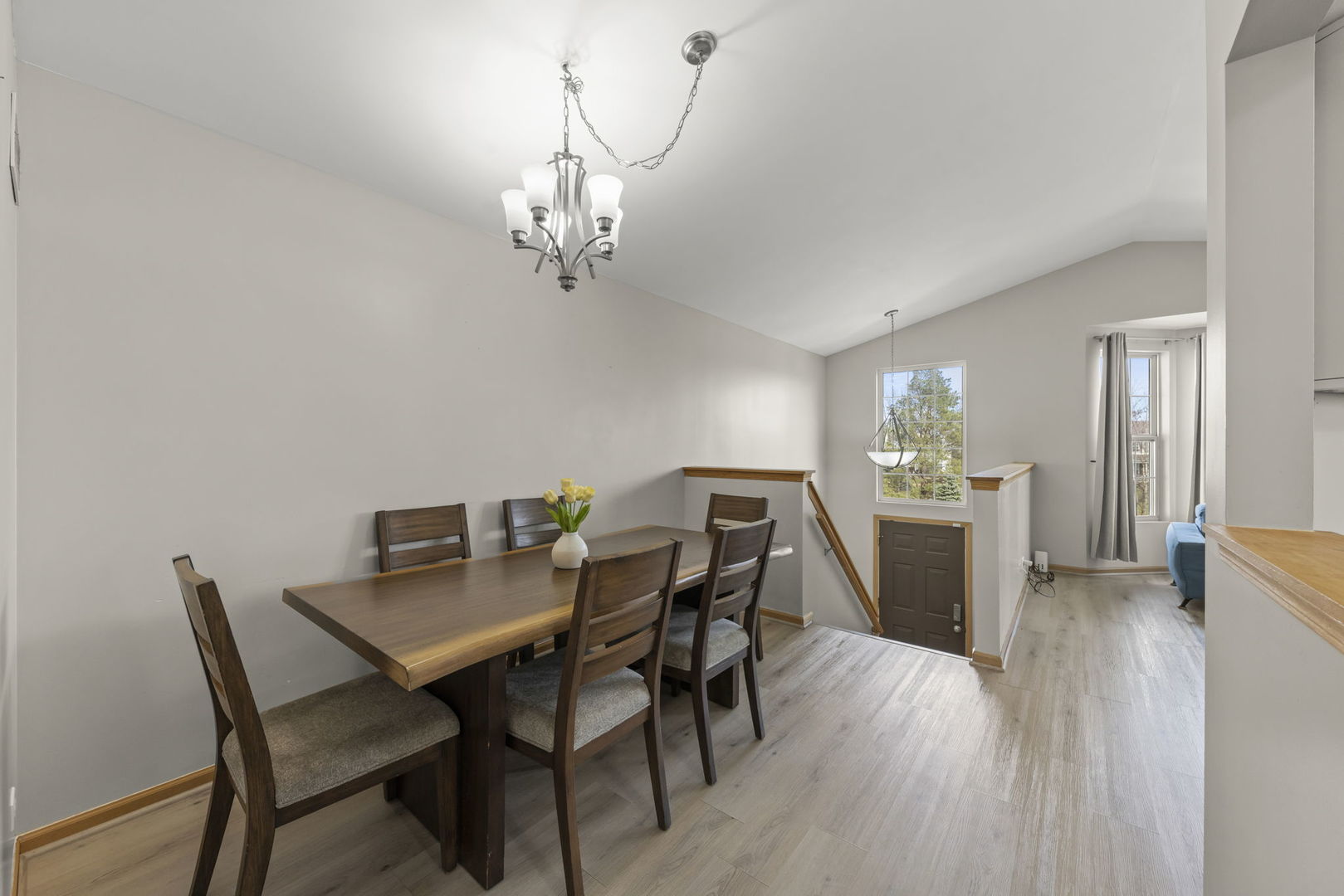 1719 Ravine Park Lane Aurora, IL 60504 - Photo 6 of 23 a view of a dining room with furniture and wooden floor