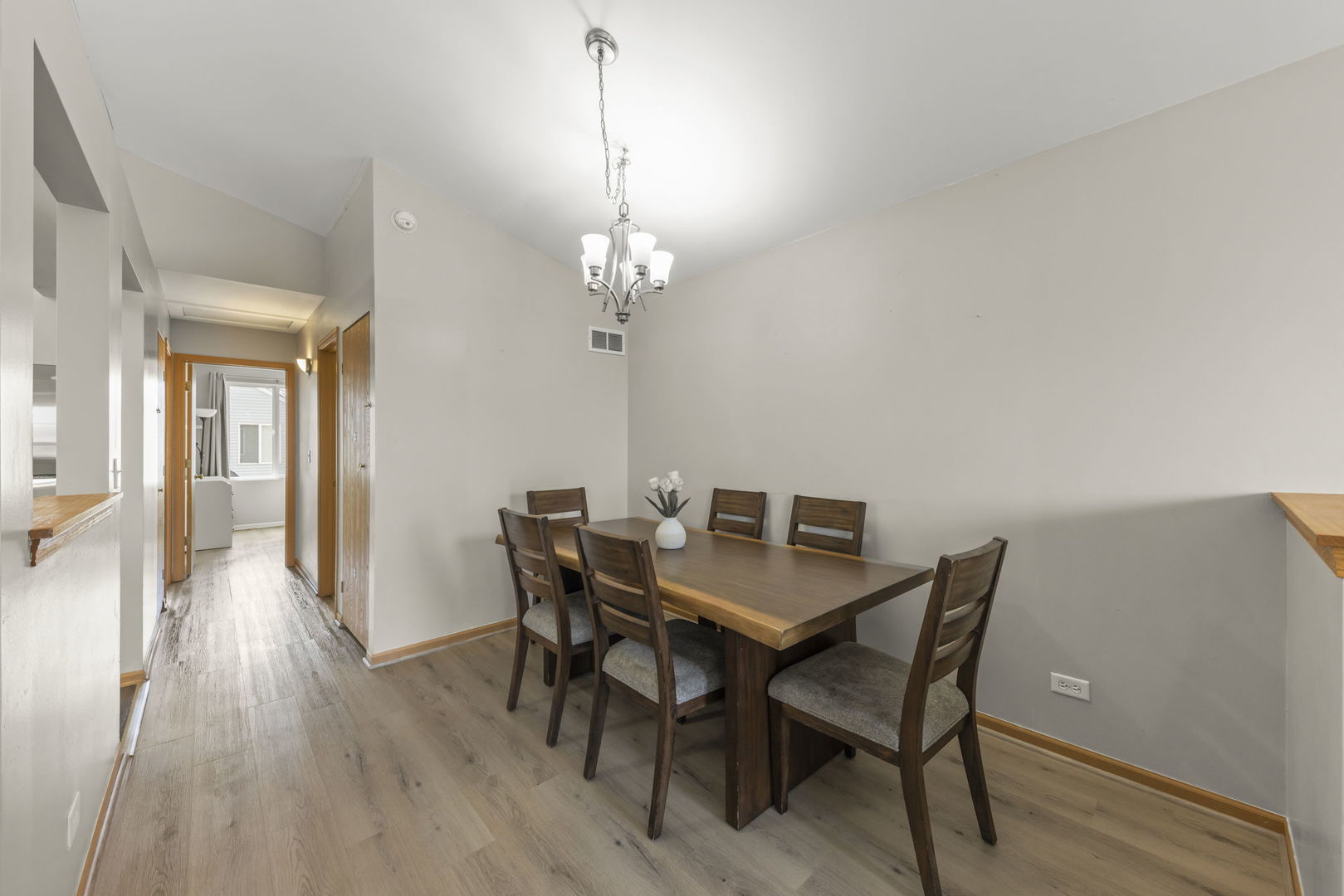 1719 Ravine Park Lane Aurora, IL 60504 - Photo 7 of 23 a view of a dining room with furniture and wooden floor