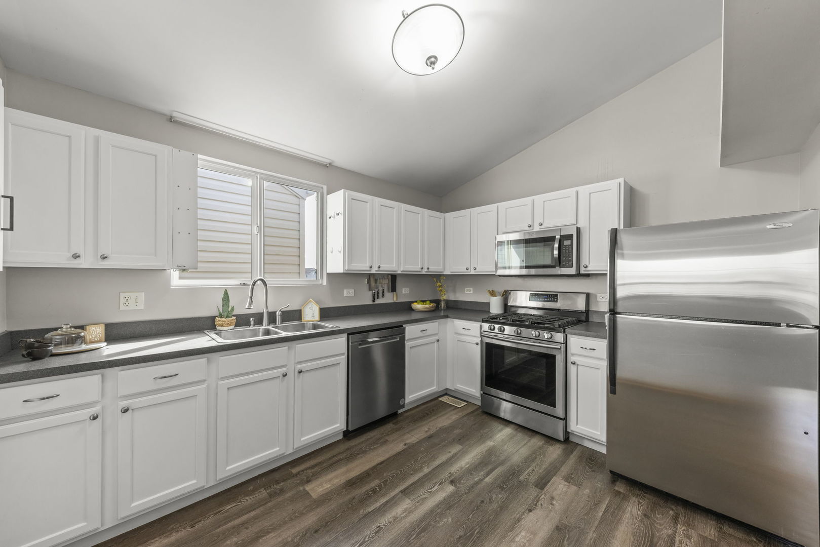 1719 Ravine Park Lane Aurora, IL 60504 - Photo 9 of 23 a kitchen with appliances cabinets and a sink