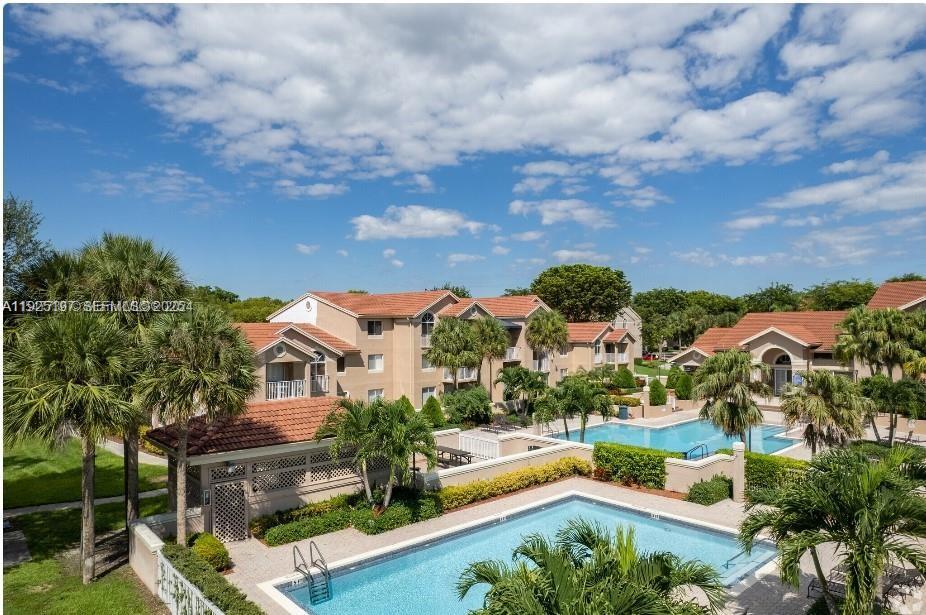 10521 Southwest 157th Place, Unit 106 Miami, FL 33196 - Photo 3 of 9 an aerial view of house with yard