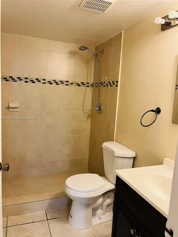 a view of a kitchen from the hallway