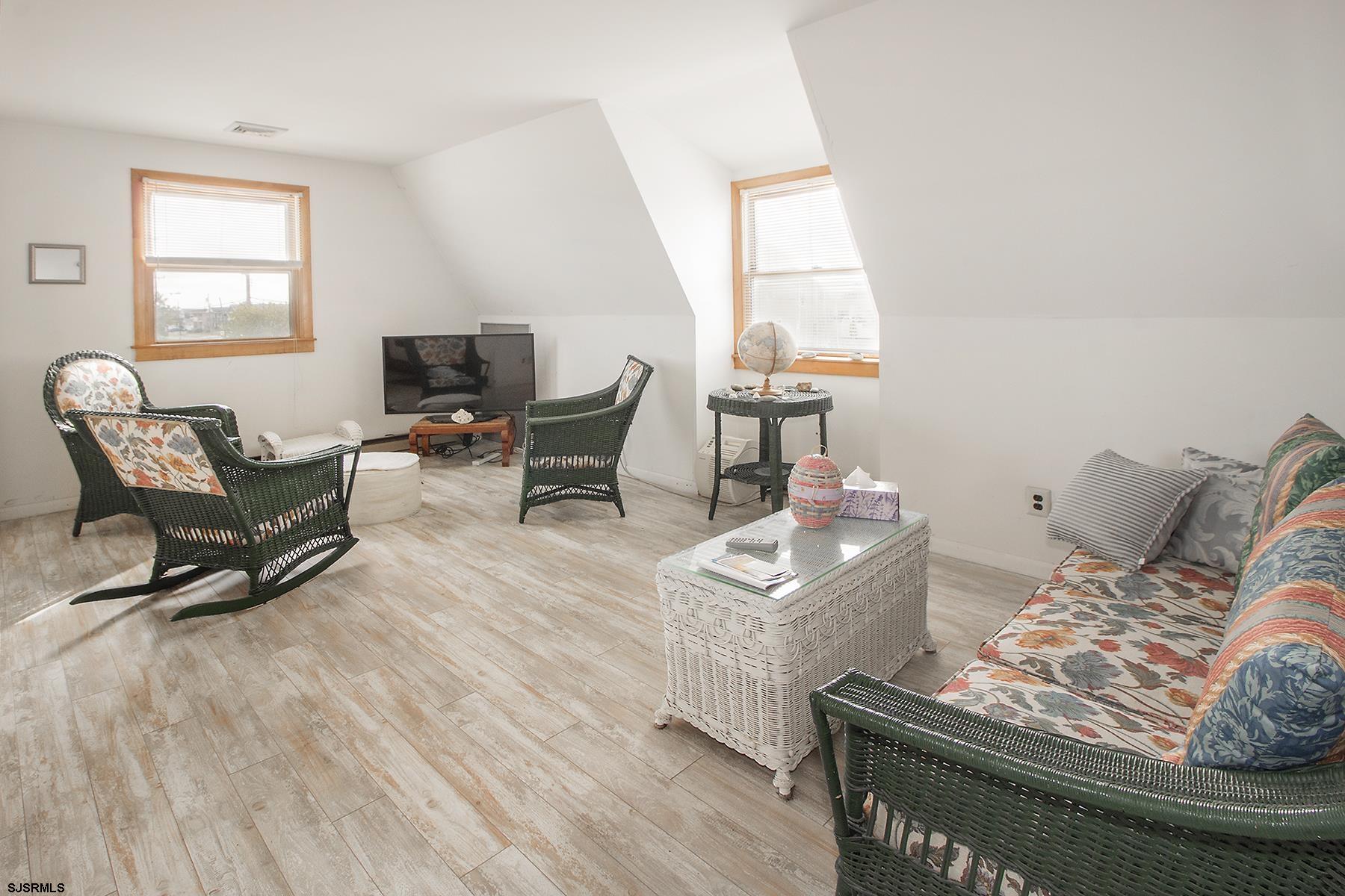4010 West Brigantine Avenue Brigantine, NJ 08203 - Photo 2 of 10 a living room with furniture and a window