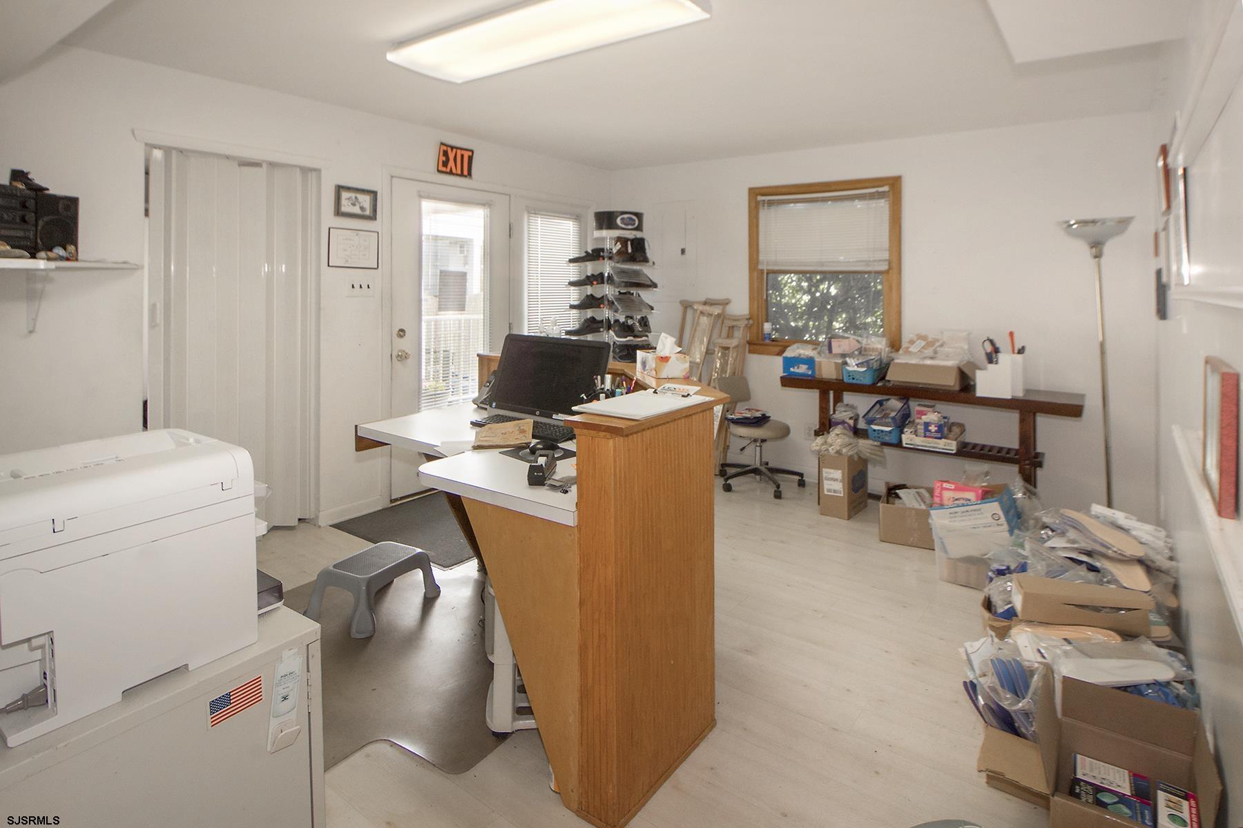 4010 West Brigantine Avenue Brigantine, NJ 08203 - Photo 6 of 10 a view of a workspace with furniture and a living room