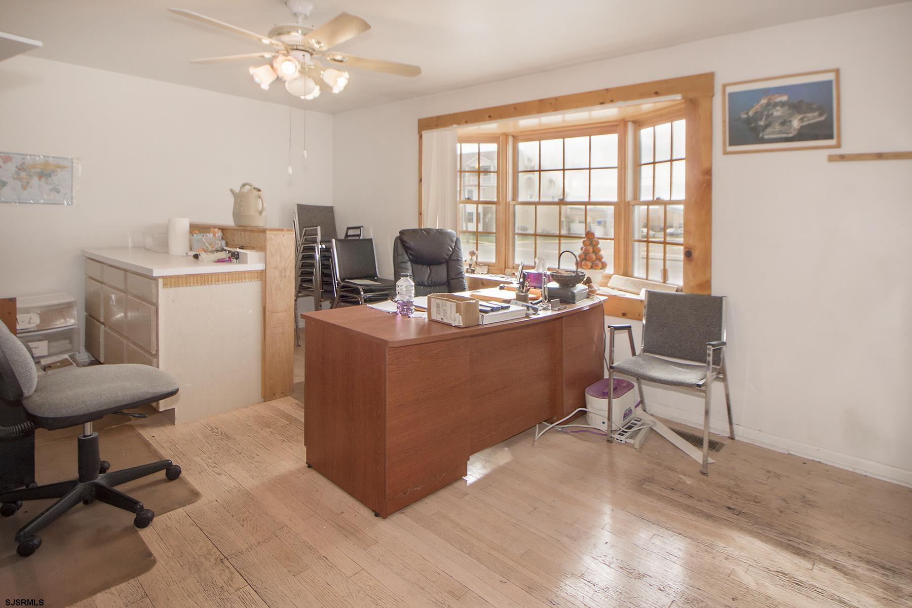 4010 West Brigantine Avenue Brigantine, NJ 08203 - Photo 7 of 10 a view of a workspace with furniture and a window
