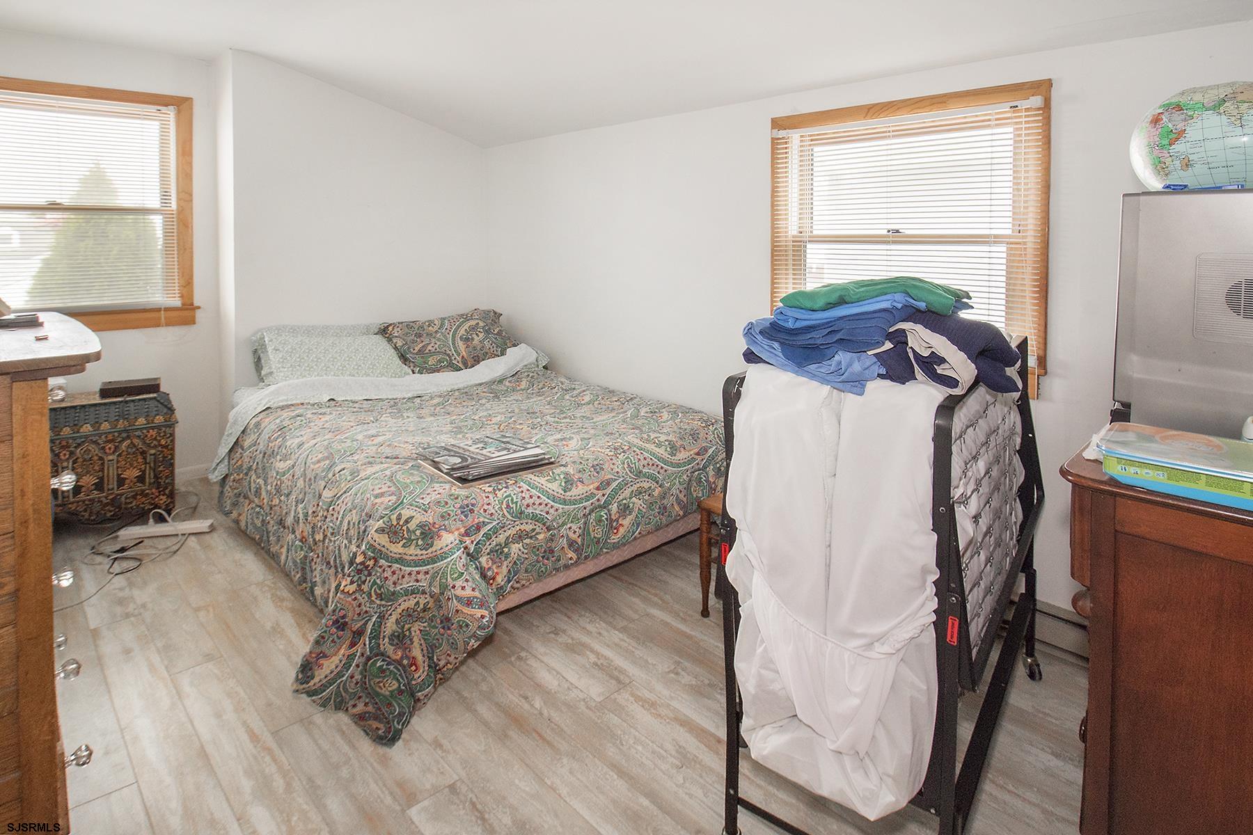4010 West Brigantine Avenue Brigantine, NJ 08203 - Photo 8 of 10 a bedroom with a bed and a window