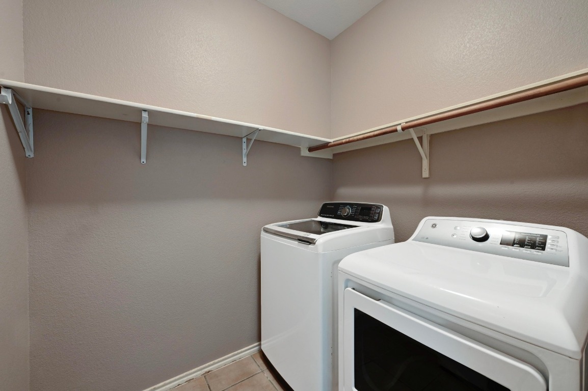 964 Hometown Parkway Kyle, TX 78640 - Photo 17 of 38 a utility room with dryer and washer