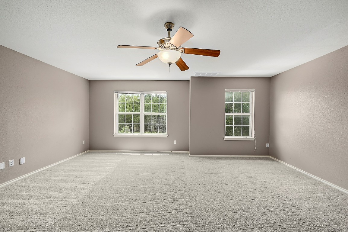 964 Hometown Parkway Kyle, TX 78640 - Photo 19 of 38 a view of an empty room with window and cabinet