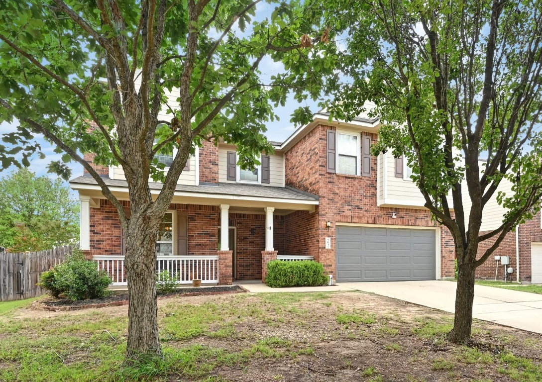 964 Hometown Parkway Kyle, TX 78640 - Photo 2 of 38 front view of a house with a yard