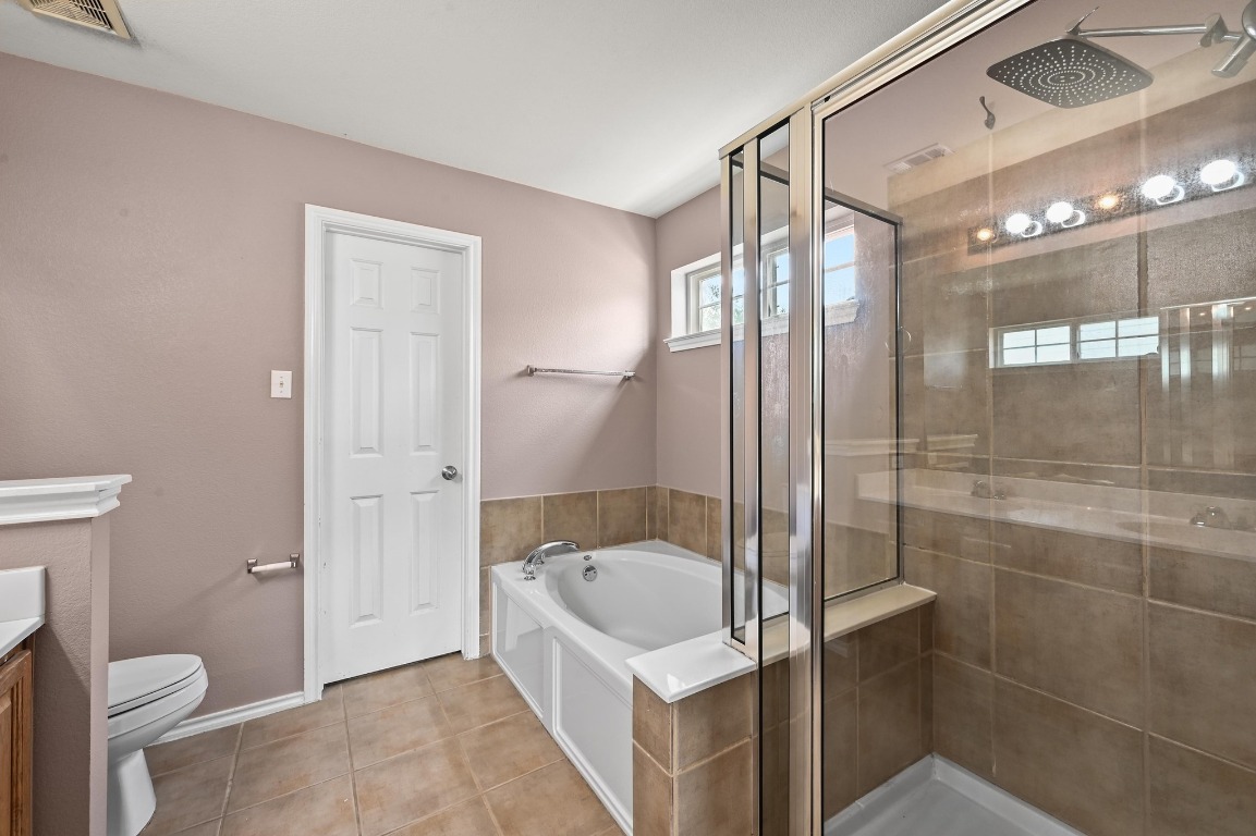 964 Hometown Parkway Kyle, TX 78640 - Photo 22 of 38 a bathroom with a sink a toilet and shower