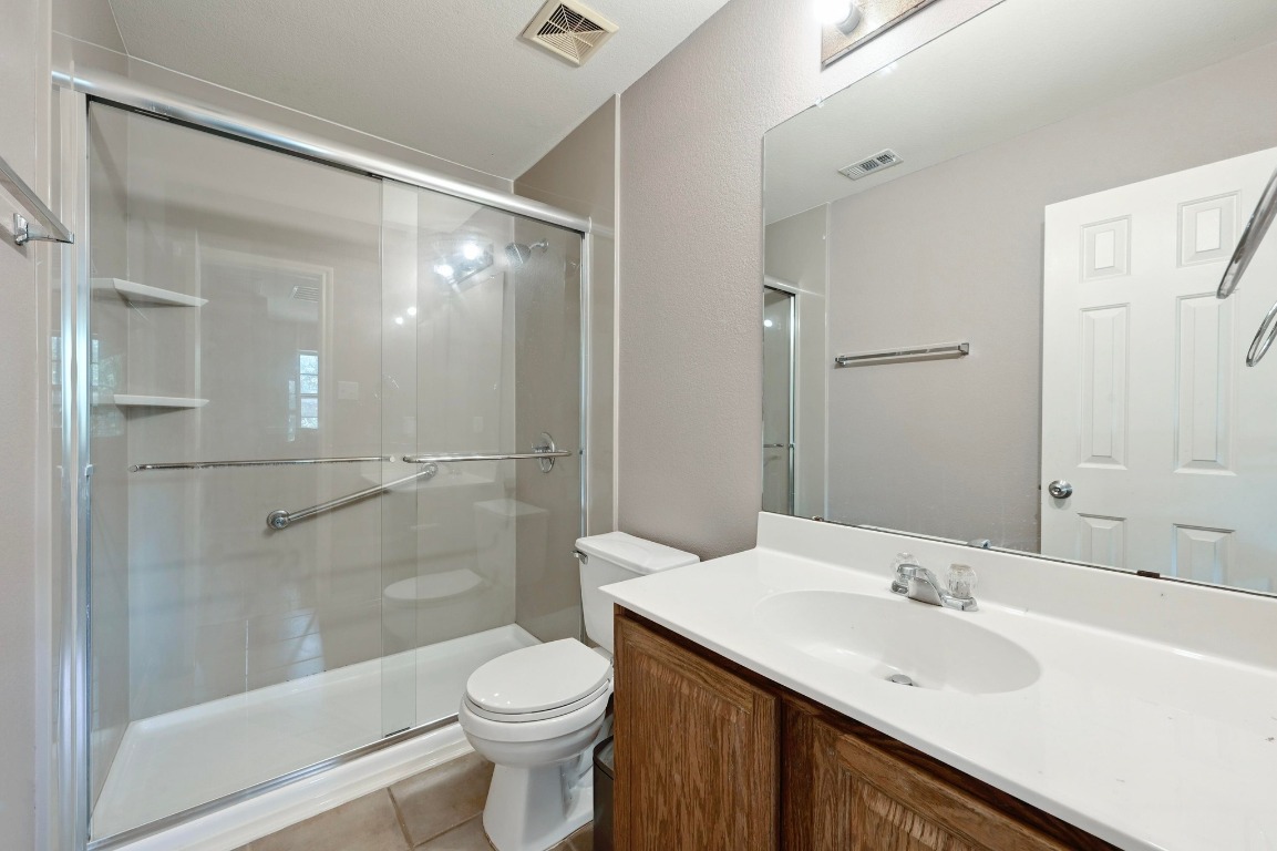 964 Hometown Parkway Kyle, TX 78640 - Photo 30 of 38 a bathroom with a sink and a mirror