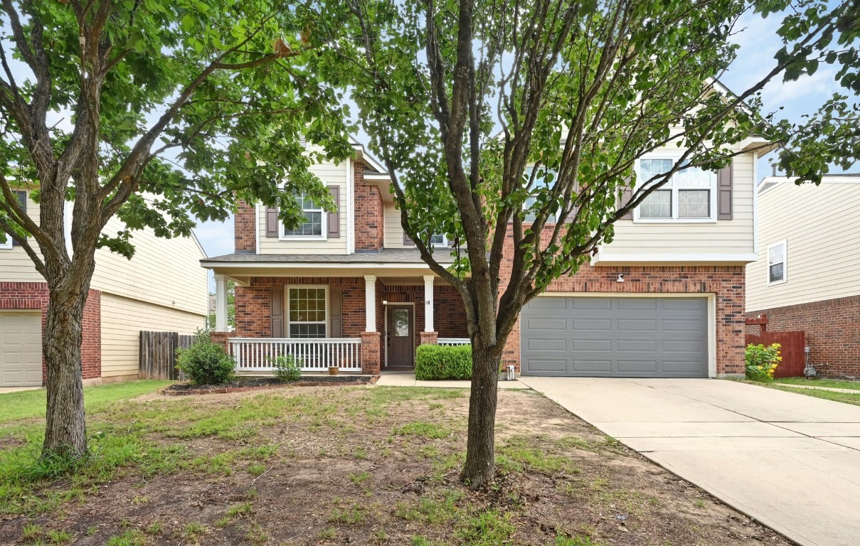 964 Hometown Parkway Kyle, TX 78640 - Photo 3 of 38 a front view of a house with garden