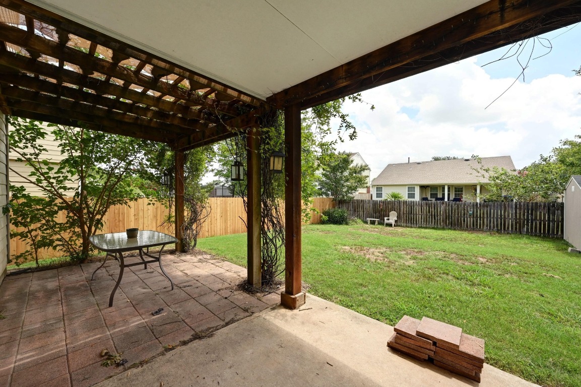 964 Hometown Parkway Kyle, TX 78640 - Photo 31 of 38 a blue bench sitting in front of a house