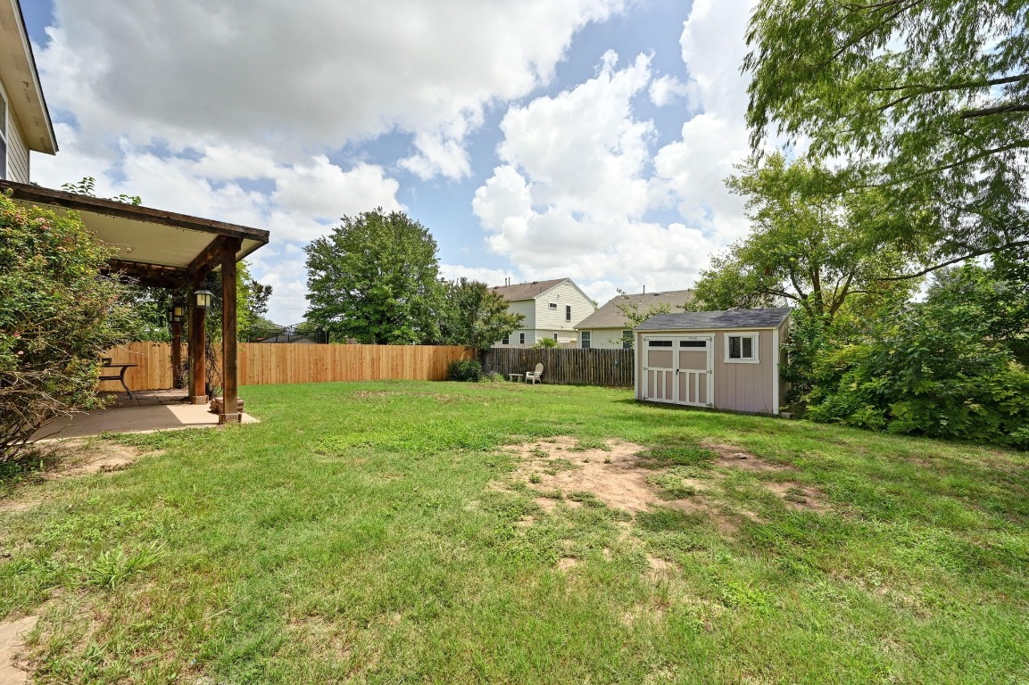 964 Hometown Parkway Kyle, TX 78640 - Photo 32 of 38 a backyard of a house with lots of green space