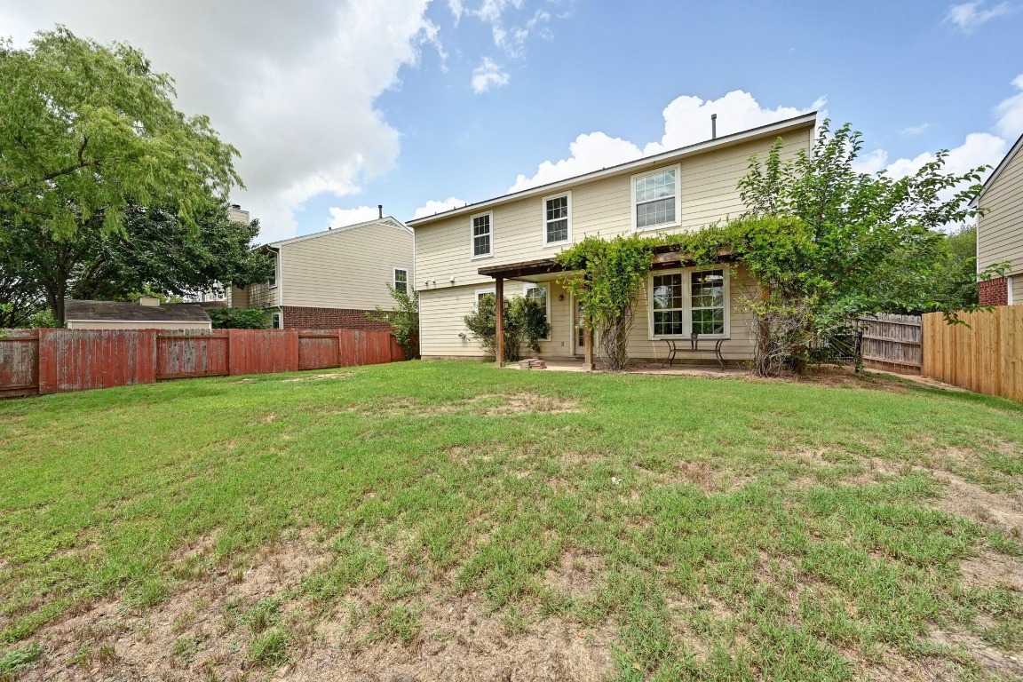 964 Hometown Parkway Kyle, TX 78640 - Photo 35 of 38 a front view of house with yard and green space