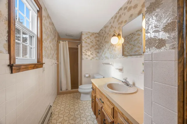 an aerial view of a house with swimming pool and outdoor space