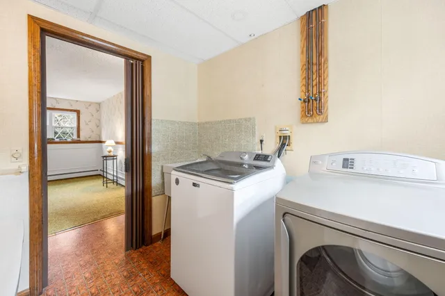 a bathroom with a sink mirror and toilet