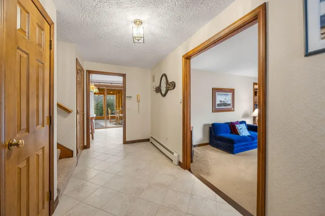 a view of a hallway view with three rooms