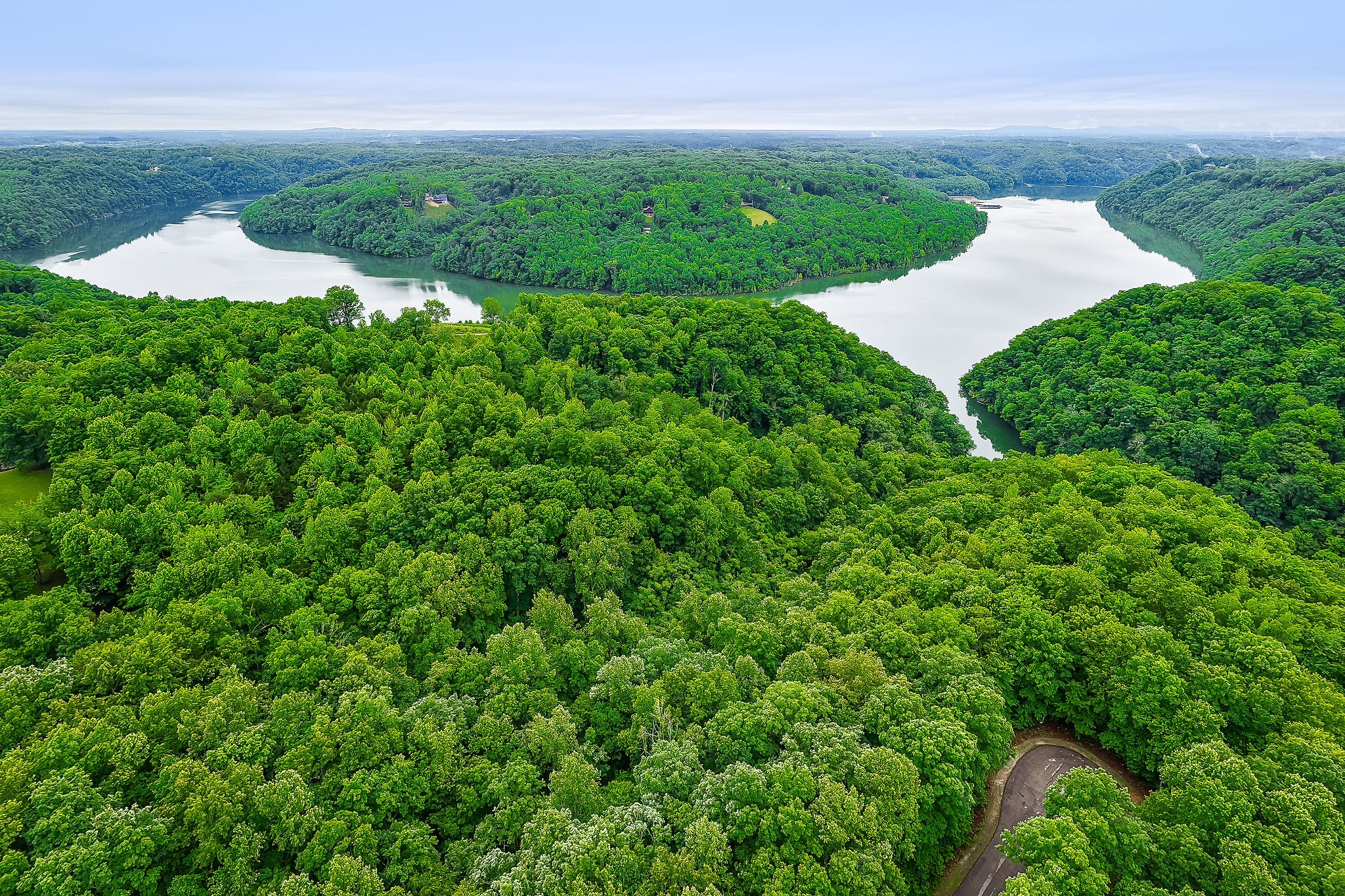 0 Knowles Street Sparta, TN 38583 - Photo 16 of 24 a view of a lake with a building in the background