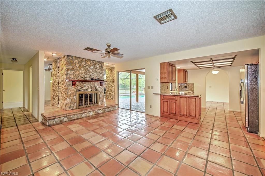 5960 Copper Leaf Lane Naples, FL 34116 - Photo 11 of 37 a living room with a large windows