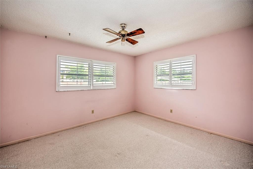 5960 Copper Leaf Lane Naples, FL 34116 - Photo 16 of 37 a view of an empty room with a window