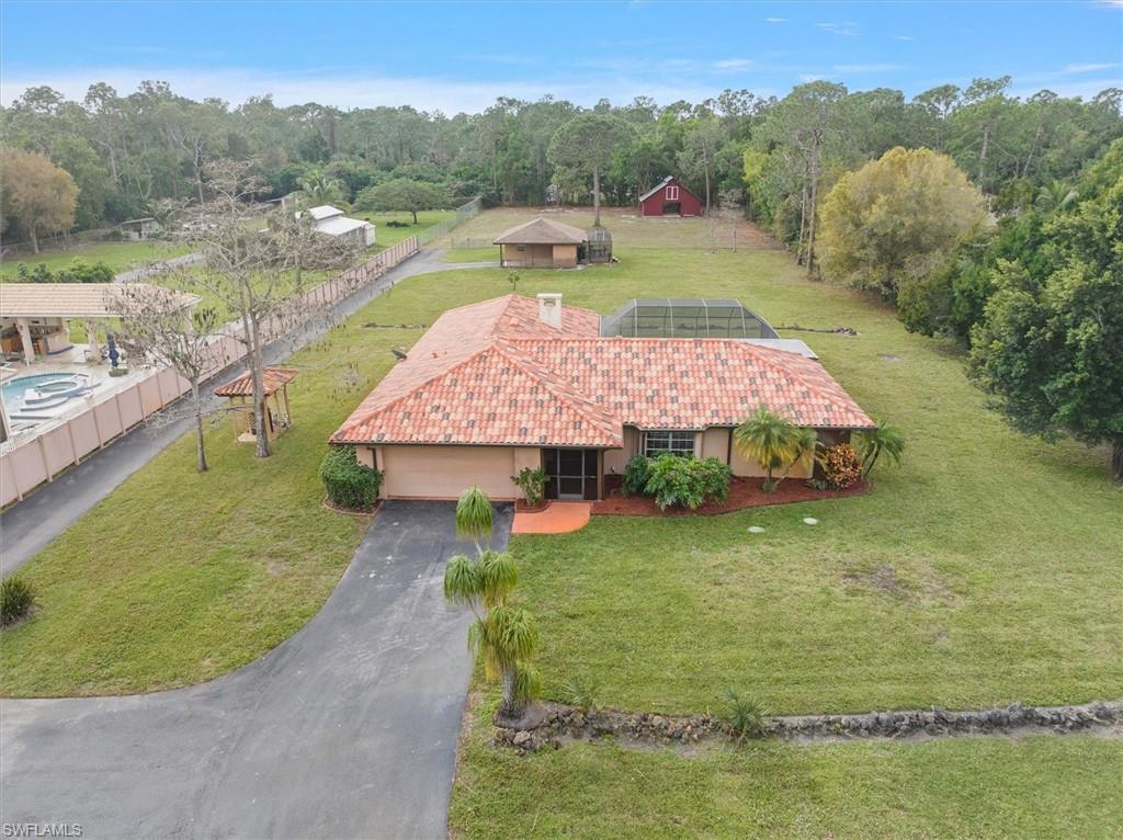 5960 Copper Leaf Lane Naples, FL 34116 - Photo 2 of 37 a view of a backyard with a lake view