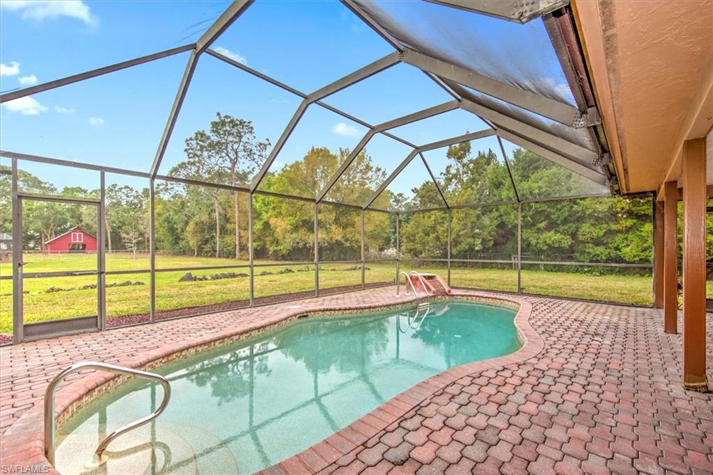 5960 Copper Leaf Lane Naples, FL 34116 - Photo 22 of 37 a view of a garden with an outdoor seating